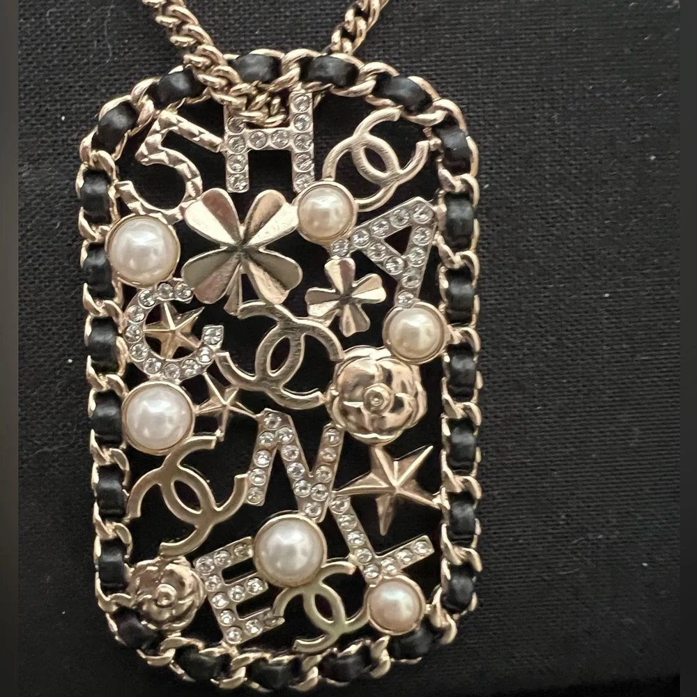 CHANEL Pendant Necklace Clover Lambskin Leather Chain Logo Crystal Mosaic Pearl